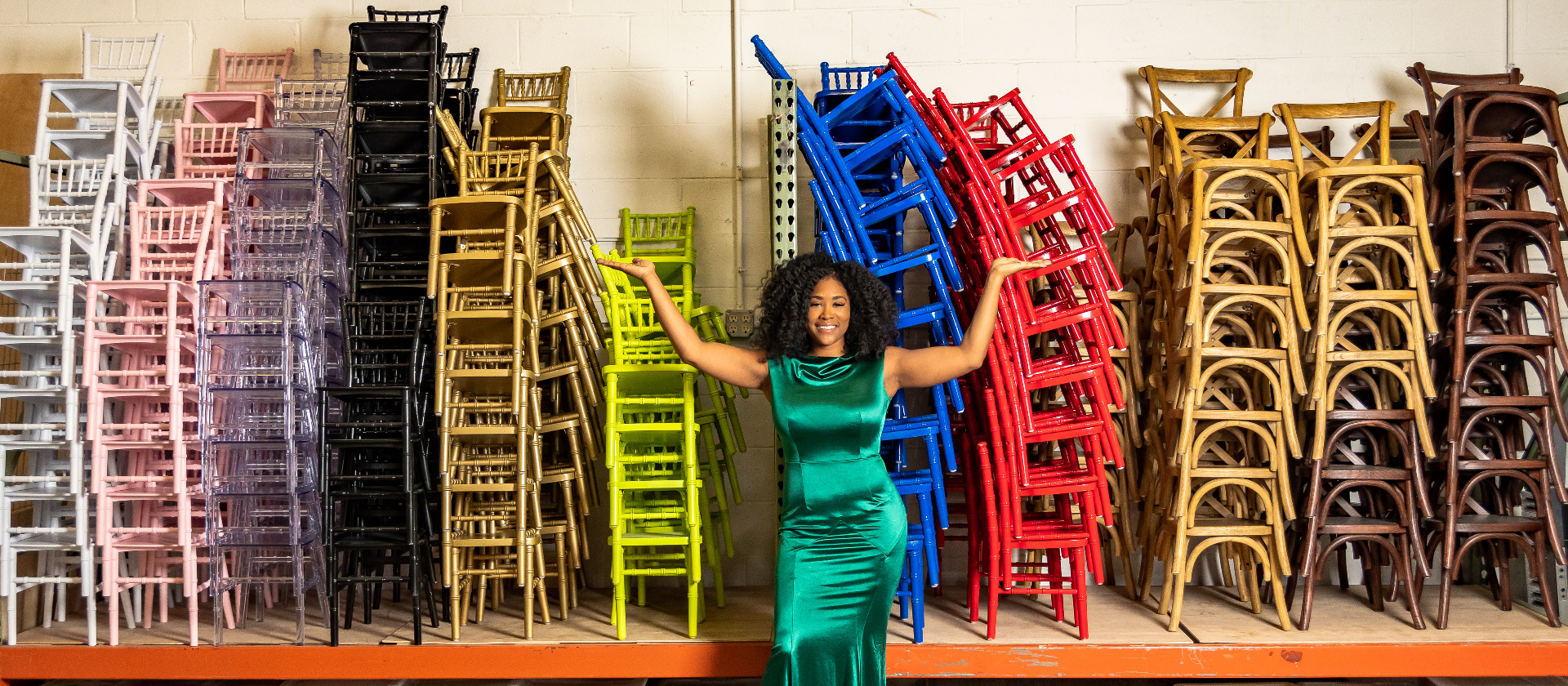 CeCe surrounded by colorful chiavari chairs